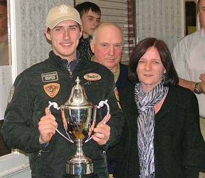 Karl McPhilips receiving the Philip Hogarty Memorial Trophy from Jack Lowry and Philip's mother at the Kilkenny congress