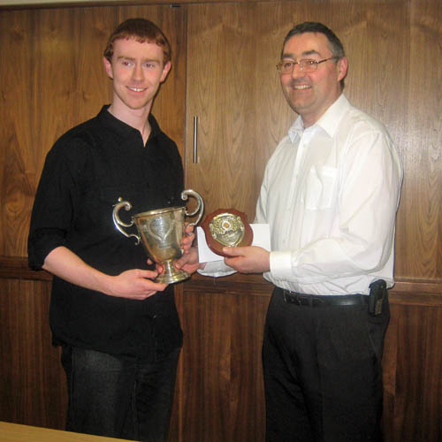 Leinster Championships - David Fitzsimons getting his prize in the Open from his old man.