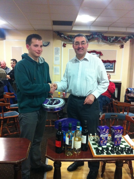 Yuri Firstov (left) winner of the 2012 Leinster Christmas Blitz receiving his prize from Pat Fitzsimons of the LCU