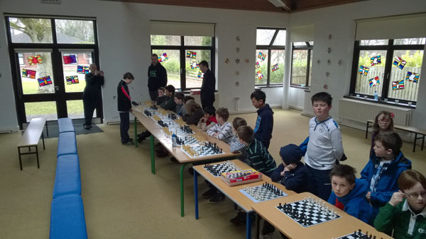 Padraig Hughes (12) giving a simultaneous display against Curragh Junior Chess Club